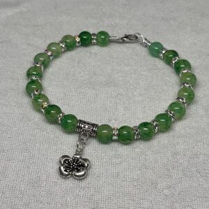 Elegant Green Bracelet with Silver Flower Charm
